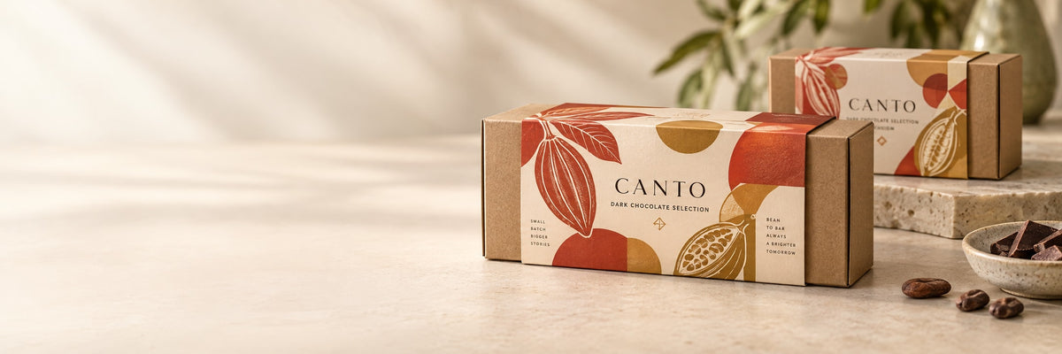 Canto chocolate gift boxes wrapped with coral and gold printed packaging sleeves